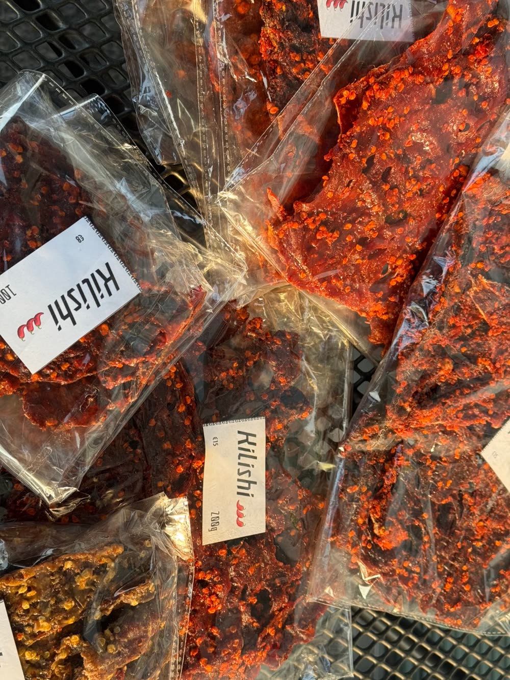 A table of kilishi pouches ready to go